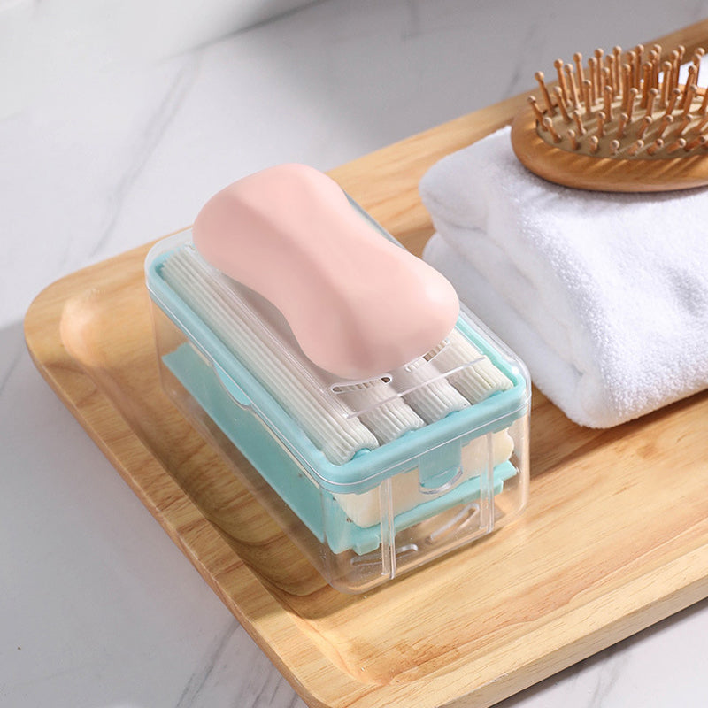 "Multifunktionell tvållåda i grå och blå, kompakt för badrum, med bubbelgenerator och anti-glid, hållbart PP-material."