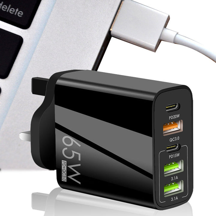 "Multiportadapter 65W snabbladdare, kompakt design, flera USB-portar, laddar flera enheter snabbt och effektivt."