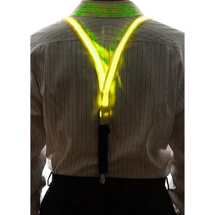 "Neonfärgade LED-hängslen och fluga för fest, i slitstark polyester, lyser i mörker, perfekt för klubbar och festivaler."