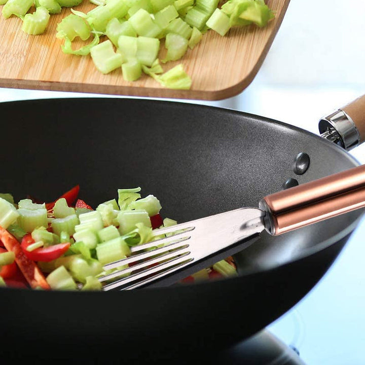 "Nonstick spatelvändare i rostfritt stål och svart silikon, elegant design, perfekt för ägg och pannkakor i köket."