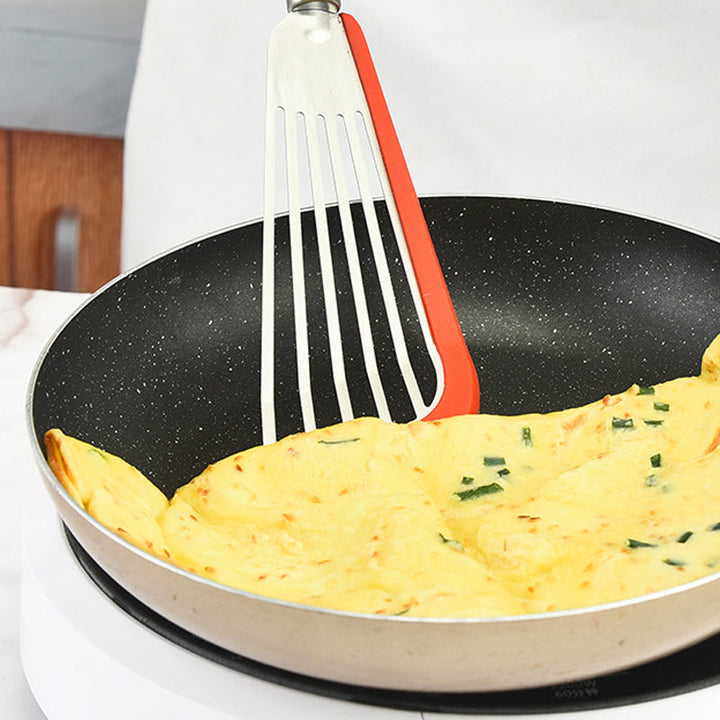"Nonstick spatelvändare i rostfritt stål och svart silikon, elegant design, perfekt för ägg och pannkakor i köket."