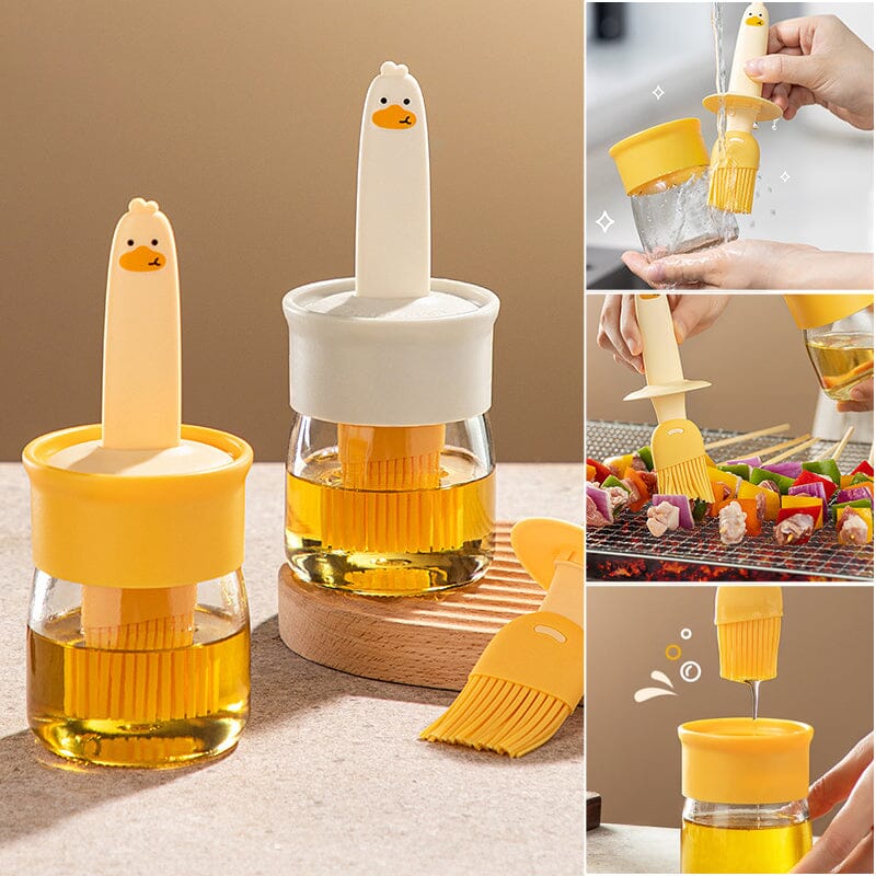 "Oljedispenser med söt ankformad silikonborste för grill, i beige och orange, perfekt för matlagning."