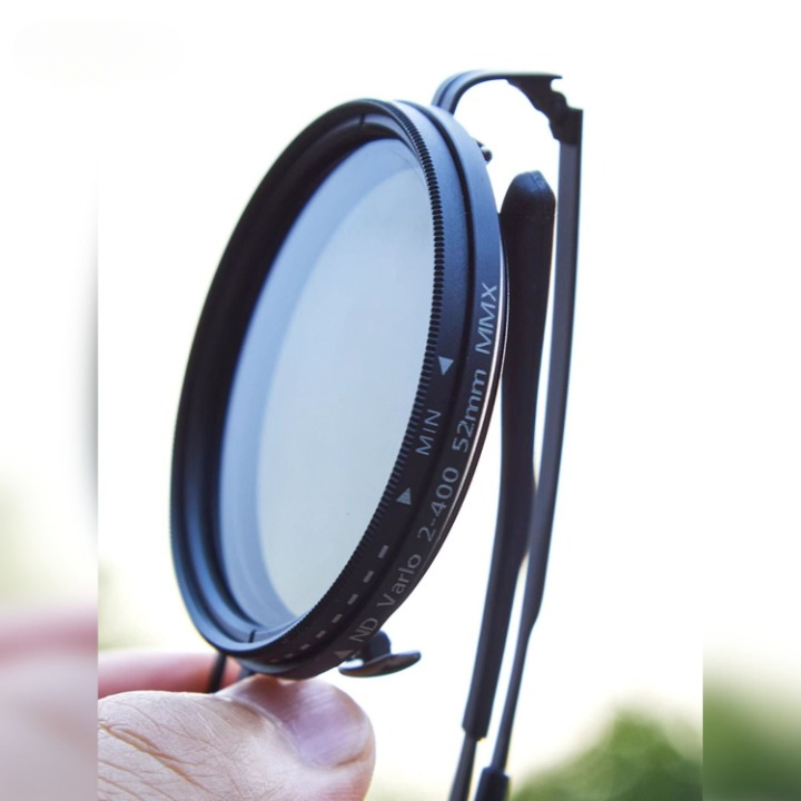 Snygga handgjorda OptiShade Pro ND9 solglasögon i sidoprofil, visar robust ram och justerbar lins.