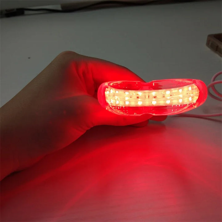 Röd ljusterapi enhet för effektiv tandköttsvård. Främjar oral hälsa med LED-terapi för hemvård.