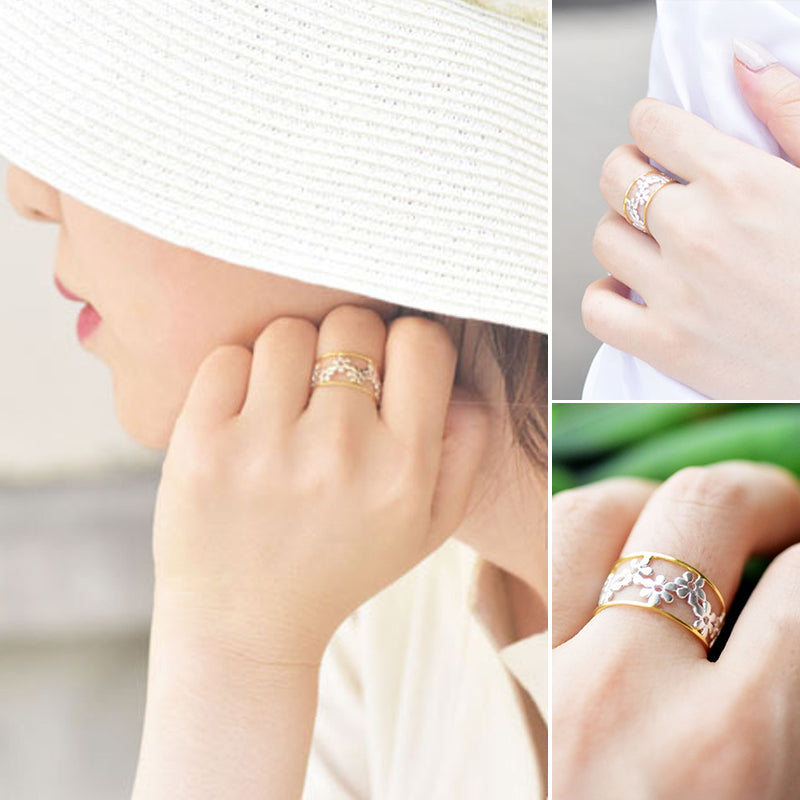 Oregelbunden ihålig tusensköna ring för kvinnor, justerbar design i legering, elegant och handgjord accessoar.