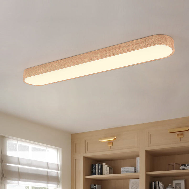 Oval LED taklampa med stilren trädetalj i nordisk design. Perfekt för modern inredning.