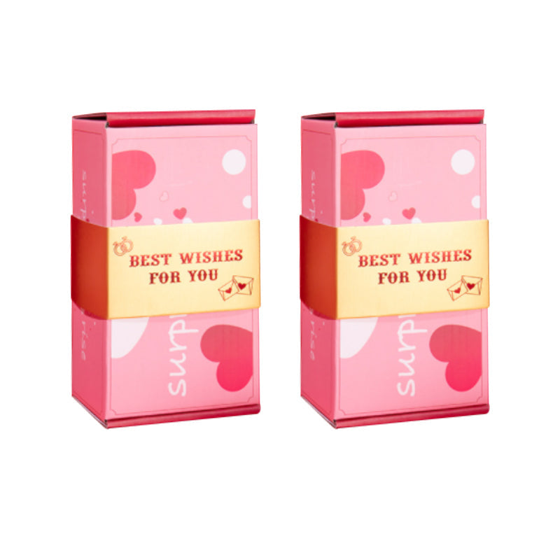 "Överraskningshoppande presentask i livfulla färger, perfekt gåva med popup-effekter, innehåller rosa och gula nyanser."