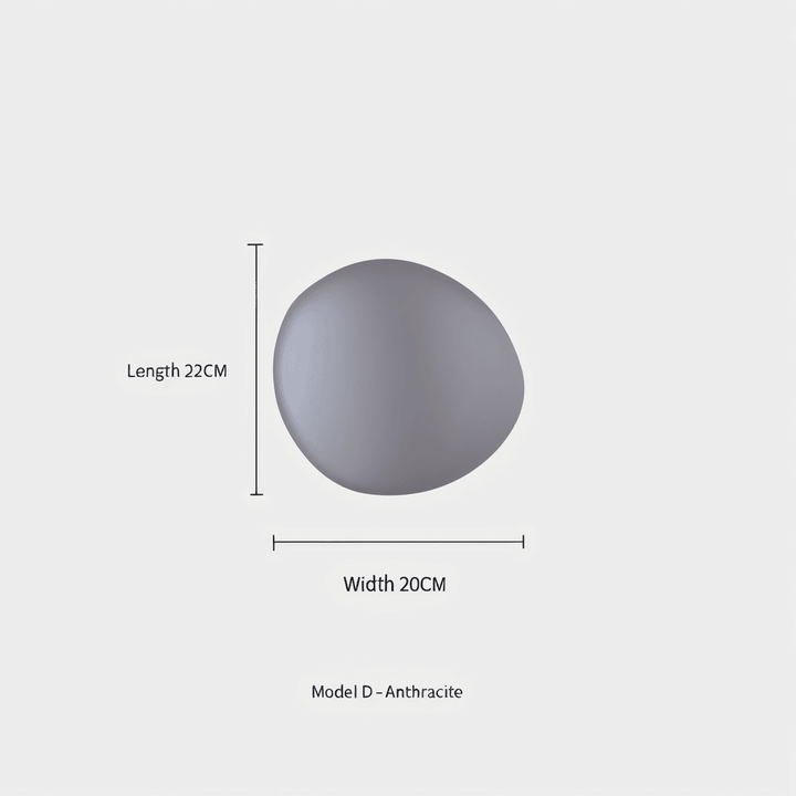 Modern LED-vägglampa PebbleHue, perfekt för att accentuera konst eller väggar.