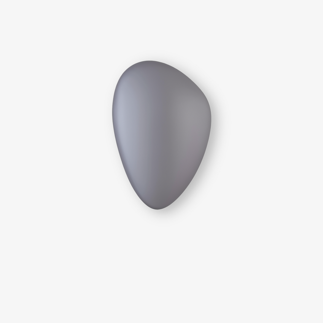 PebbleHue LED-vägglampa, sprider ett mjukt ljus, perfekt för mysbelysning.