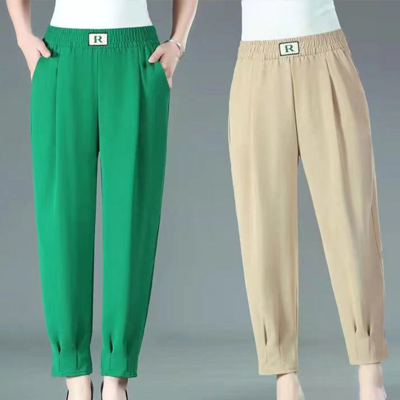 "Plus size harembyxor för damer med stretchig midja i grön, lös och bekväm passform, perfekt för vardag och avslappning."