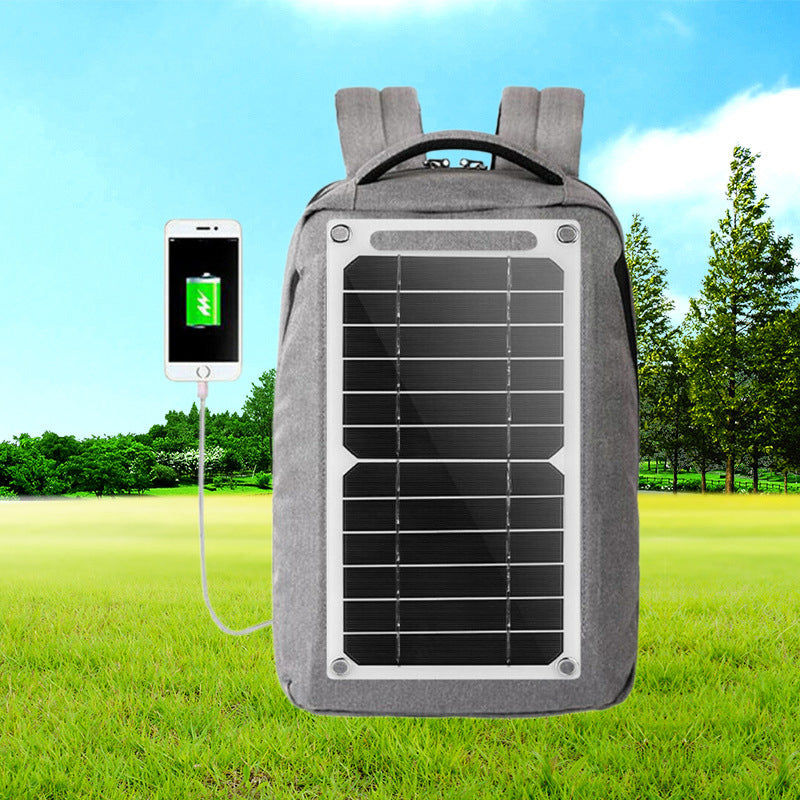 "Portabel 30W solpanel med USB, tunn design, svart yta, sugkoppar för montering, perfekt för utomhusäventyr."