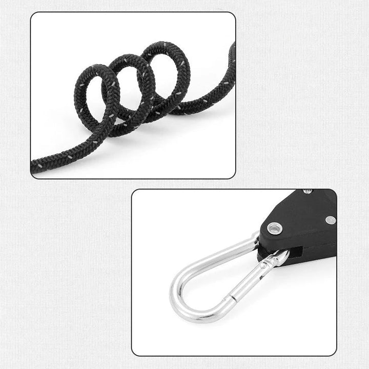 Portabel justerbar fixeringsrep, svart med reflextråd, inkluderar karbinhakar; idealiskt för camping- och utomhusbruk.