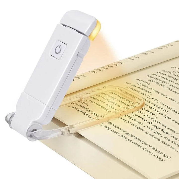 "Portabel justerbar uppladdningsbar LED-boklampa i rosa, svart, grön, blå eller vit med flexibel hållare och USB-laddning."