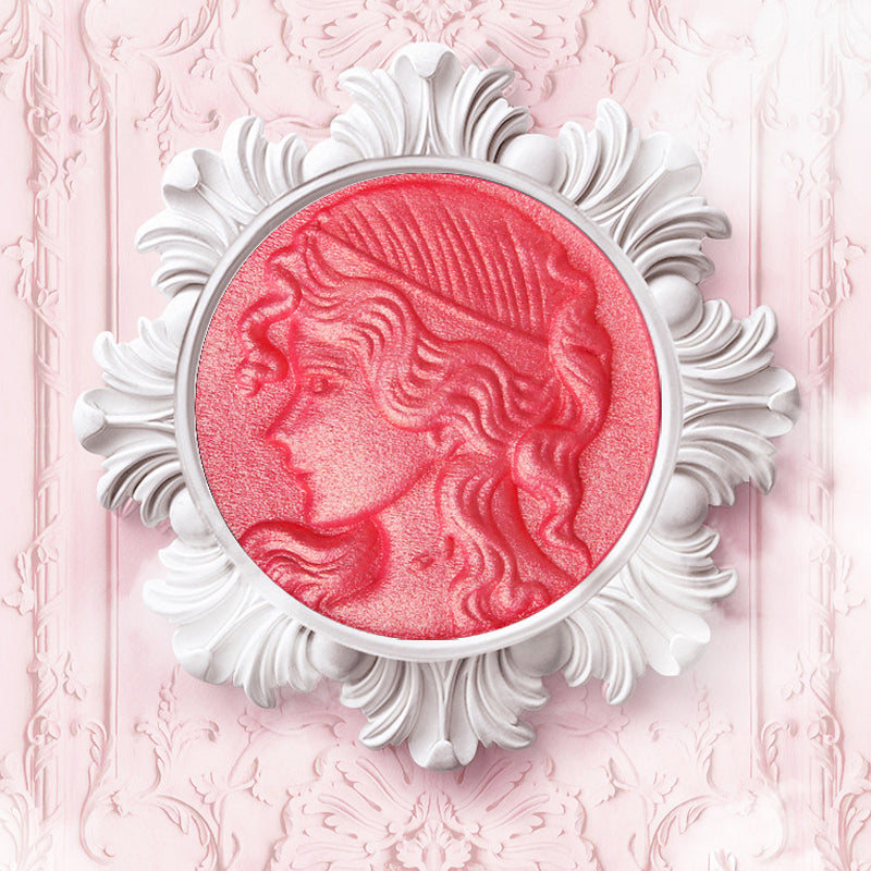 "Präglad puderrougepalett med naturlig glöd, elegant design, subtil skimmer och nyanser rosa till apelsin för alla hudtoner."
