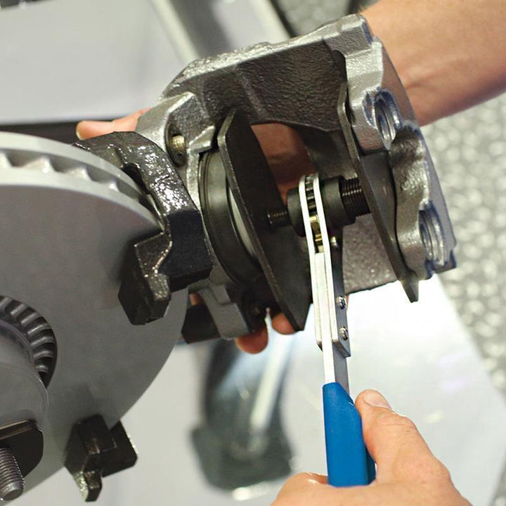 "Professionellt bromsok pressverktyg med rött stort handtag och blått litet handtag för effektiv bromsunderhåll."