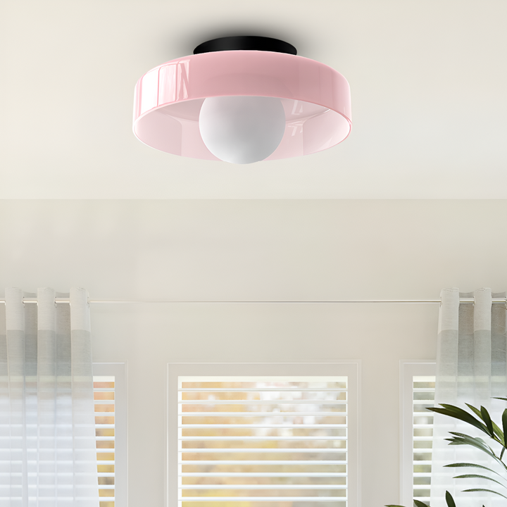 Färgstark rund LED-plafond i retrostil, perfekt som vägg- eller taklampa.