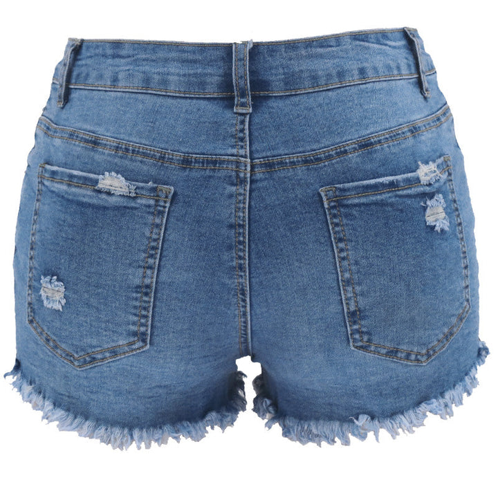 "Rippade jeansshorts i bomull med trendig design, klassisk blå färg, avslappnad stil för damer sett framifrån."