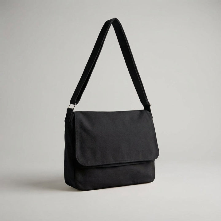 Vardaglig unisex canvasväska, en praktisk axelväska för skola och jobb. Robust och bekväm pendlarväska.