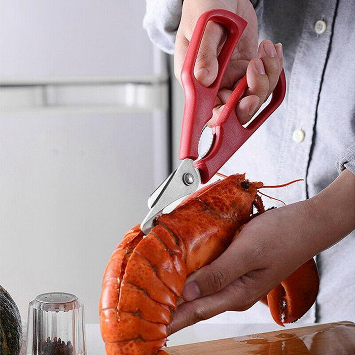 "Röd och svart skaldjurssax i rostfritt stål för effektiv och stilren krabbskärning, 7 tum lång, med ergonomiskt grepp."