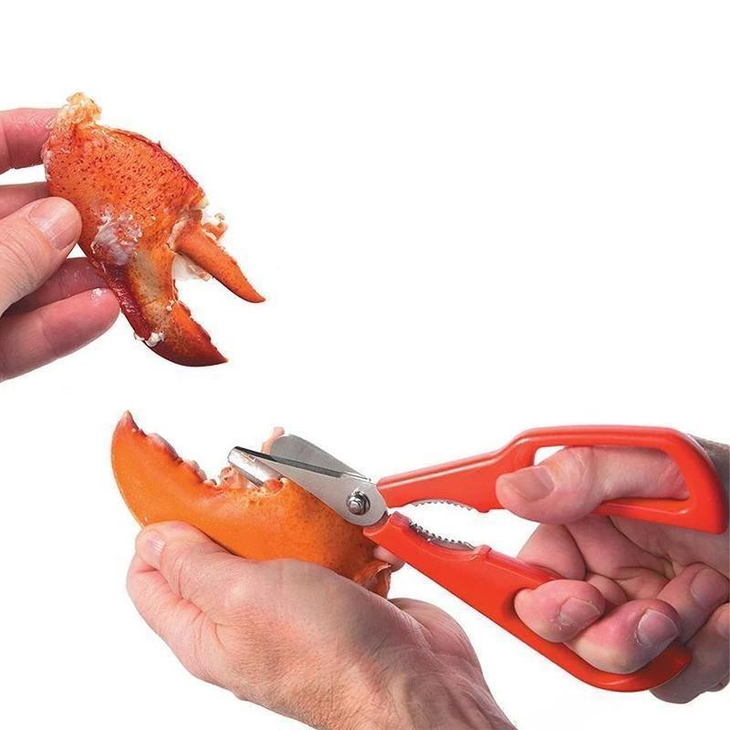 "Röd och svart skaldjurssax i rostfritt stål för effektiv och stilren krabbskärning, 7 tum lång, med ergonomiskt grepp."