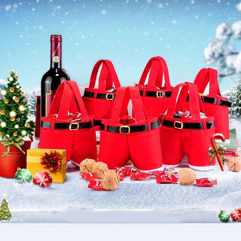 "Röd tomteluva presentpåse i klassisk stil med vit kant, idealisk för julgåvor och dekorativ användning."