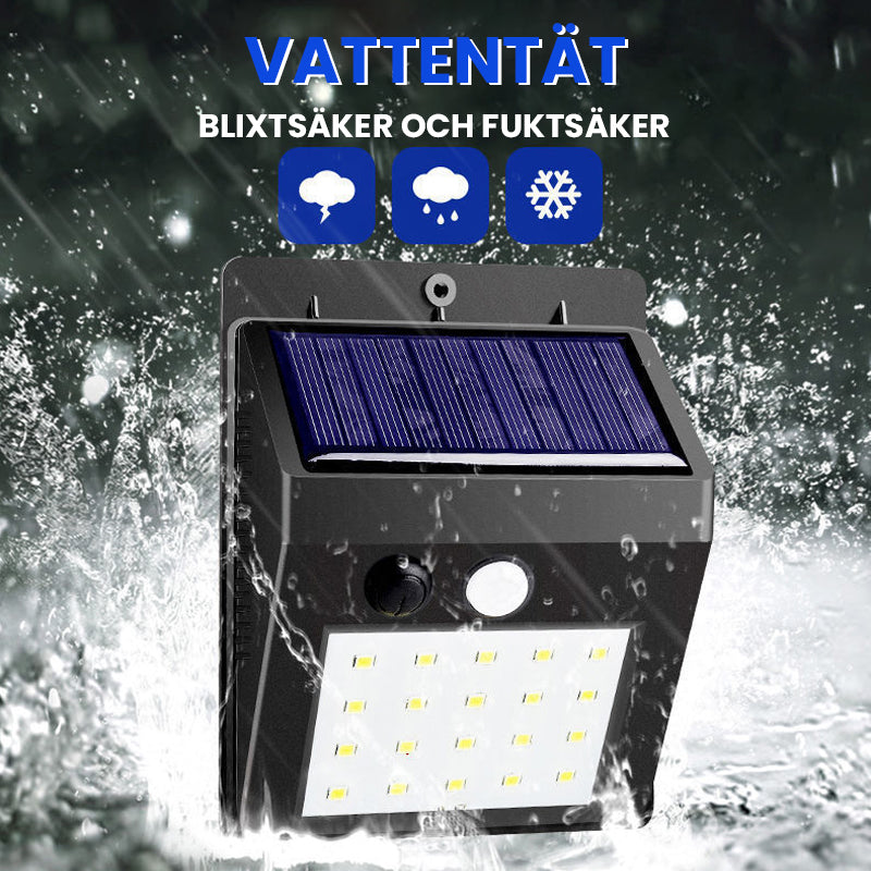 "Rörelsesensor LED-lampa utomhus IP65, solcellsdriven med 30 LED, robust svart design, perfekt för trädgårdsbelysning."