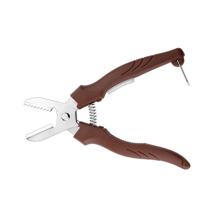 "Rostfri nötöppnare med brun detaljer, ergonomisk design för enkel öppning av valnötter och kastanjer i köket."
