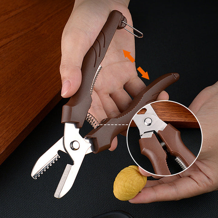 "Rostfri nötöppnare med brun detaljer, ergonomisk design för enkel öppning av valnötter och kastanjer i köket."