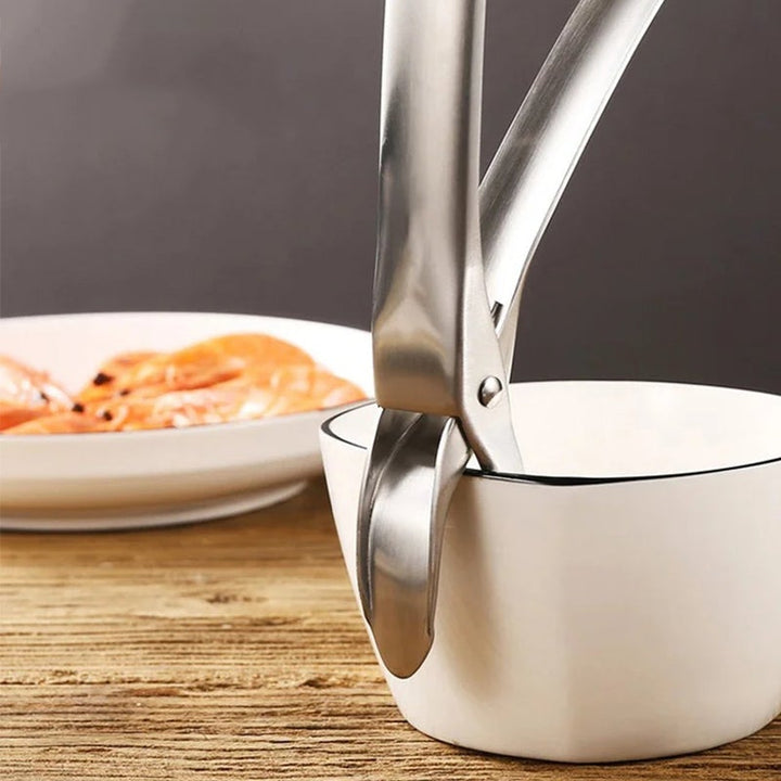 "Rostfri tång för kokplattor med ergonomiskt grepp, anti-halk funktion och mångsidig design för säker matlagning"