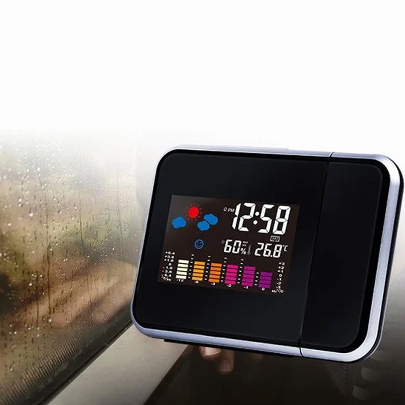 "Roterande klocka med färgdisplay, projicerar tid och temperatur i röd ton, elegant design för sovrum"