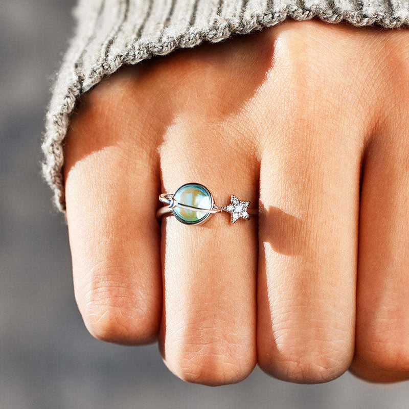 "Roterbar ångestring med stjärnmotiv i koppar för kvinnor, justerbar storlek, elegant design för stresslindring och komfort."