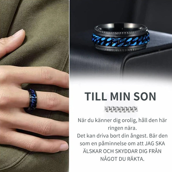 "Roterbar kedjering i rostfritt stål med geometriskt kedjemönster, finns i flera färger för både män och kvinnor."