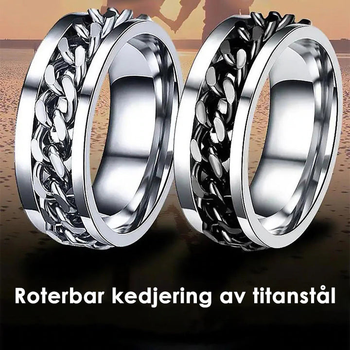 Roterbar unisex ring i titanstål, svart och stilren; elegant accessoar för modern och mångsidig stil.