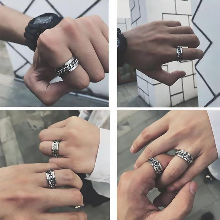 Roterbar unisex ring i titanstål, svart och stilren; elegant accessoar för modern och mångsidig stil.