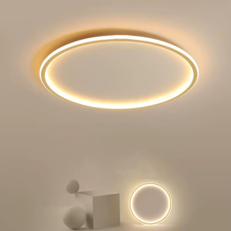 Stilren rund LED belysning för sovrummet, skapar mysig atmosfär.