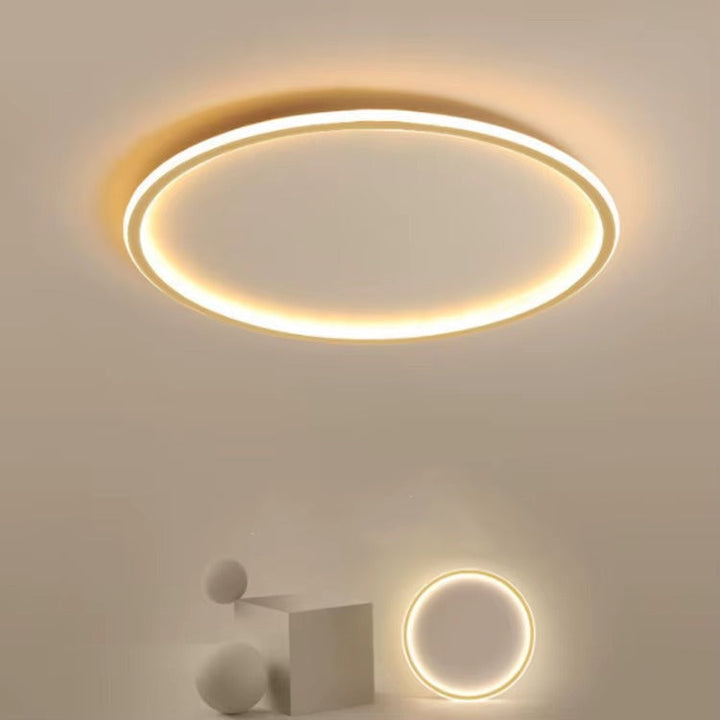 Stilren rund LED belysning för sovrummet, skapar mysig atmosfär.