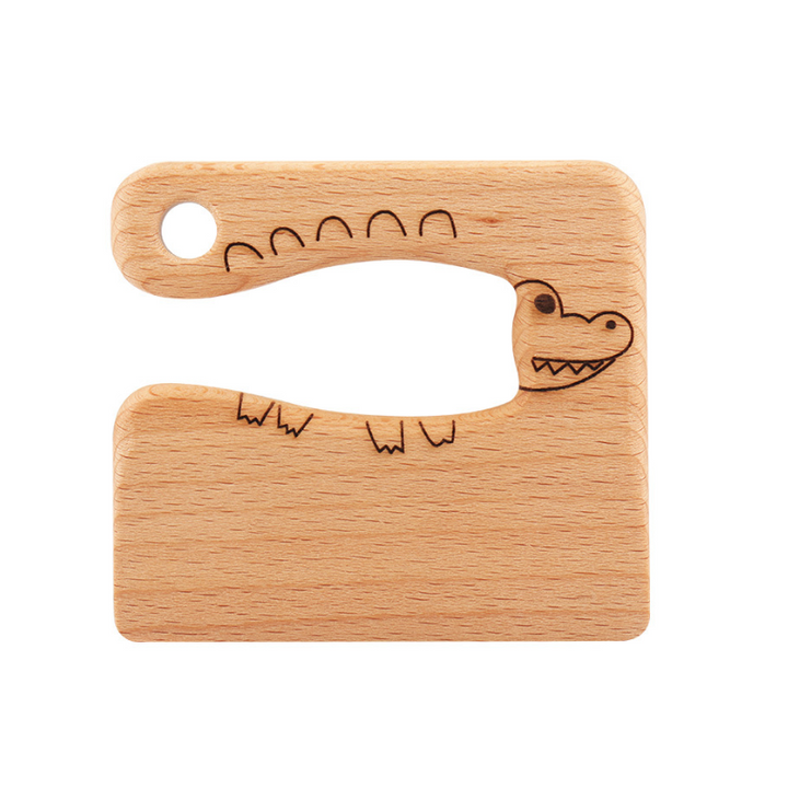 "Säker Montessori barnkniv i naturligt trä för barnköket, trubbig design och ergonomiskt grepp, perfekt för små händer."
