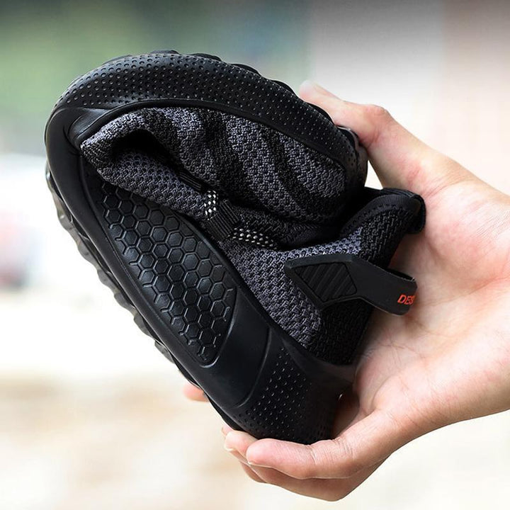 "Säkerhetsskor för män med ståltåhätta, mörk färg, halksäker sula, idealisk för arbetsmiljö, robust design."