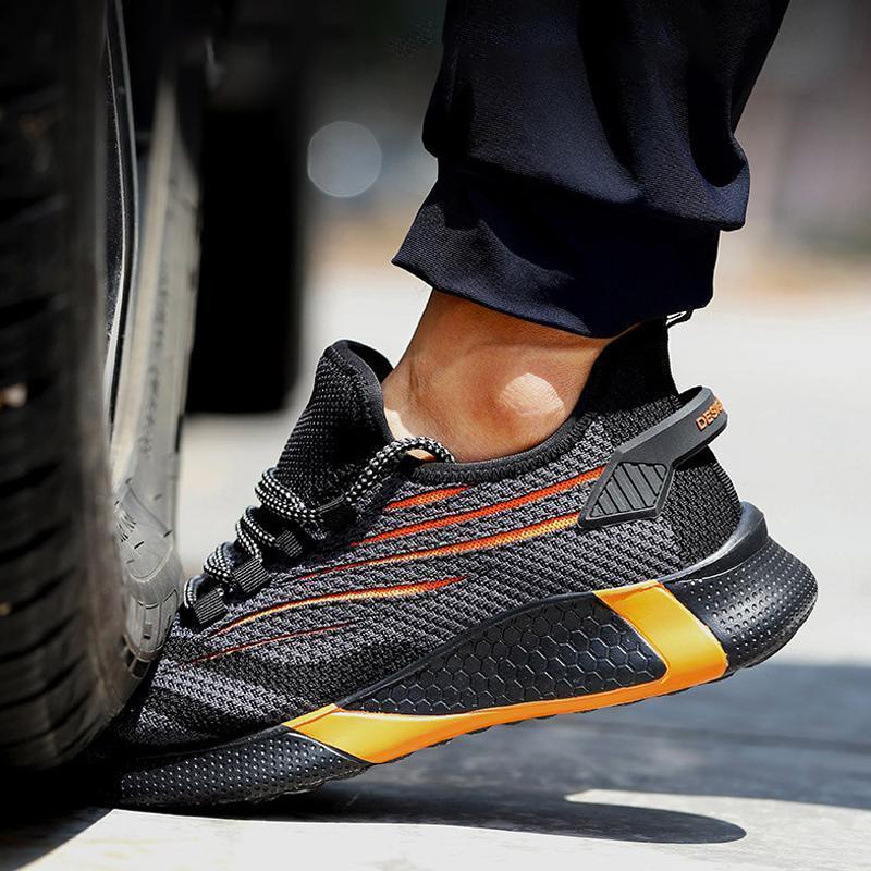 "Säkerhetsskor för män med ståltåhätta, mörk färg, halksäker sula, idealisk för arbetsmiljö, robust design."