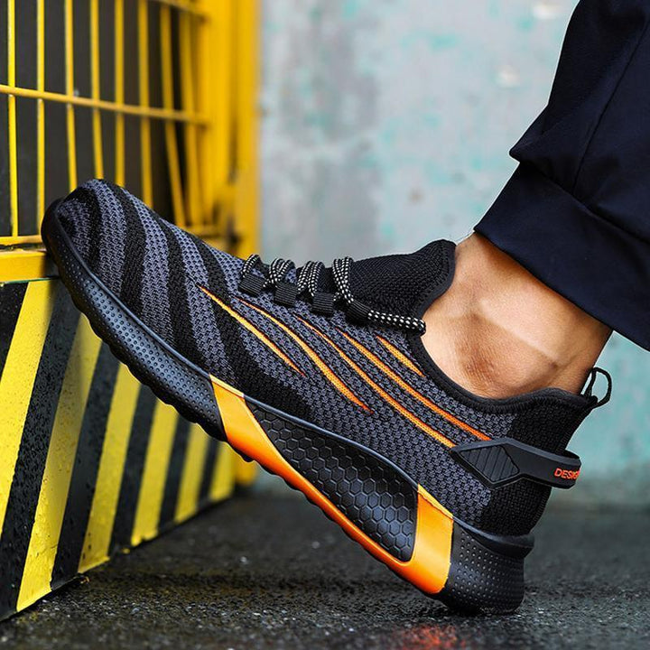 "Säkerhetsskor för män med ståltåhätta, mörk färg, halksäker sula, idealisk för arbetsmiljö, robust design."