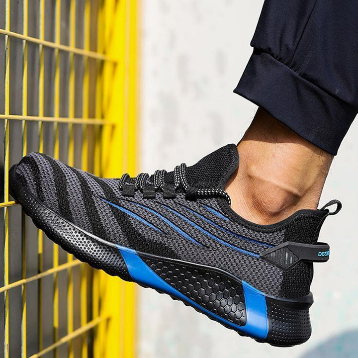 "Säkerhetsskor för män med ståltåhätta, mörk färg, halksäker sula, idealisk för arbetsmiljö, robust design."