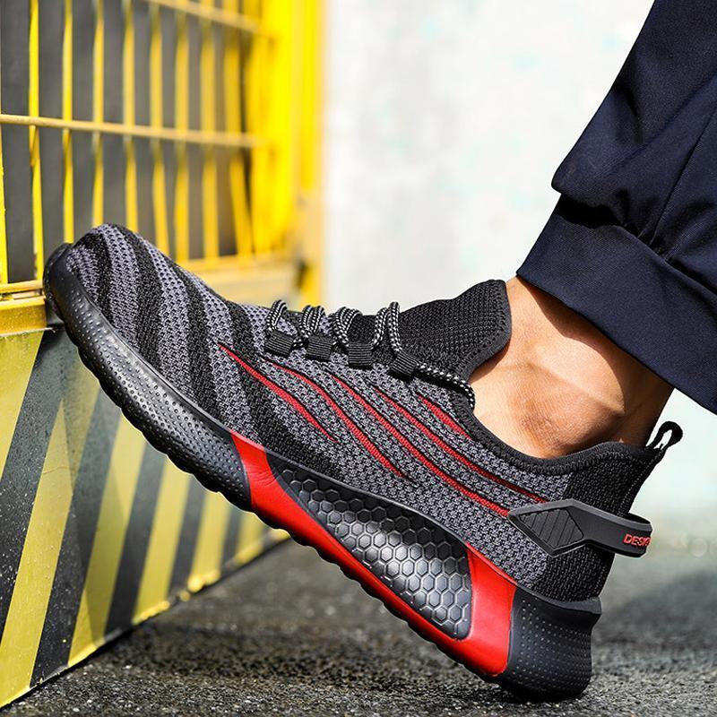 "Säkerhetsskor för män med ståltåhätta, mörk färg, halksäker sula, idealisk för arbetsmiljö, robust design."