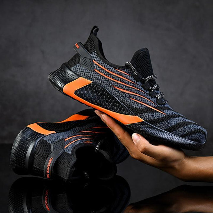 "Säkerhetsskor för män med ståltåhätta, mörk färg, halksäker sula, idealisk för arbetsmiljö, robust design."