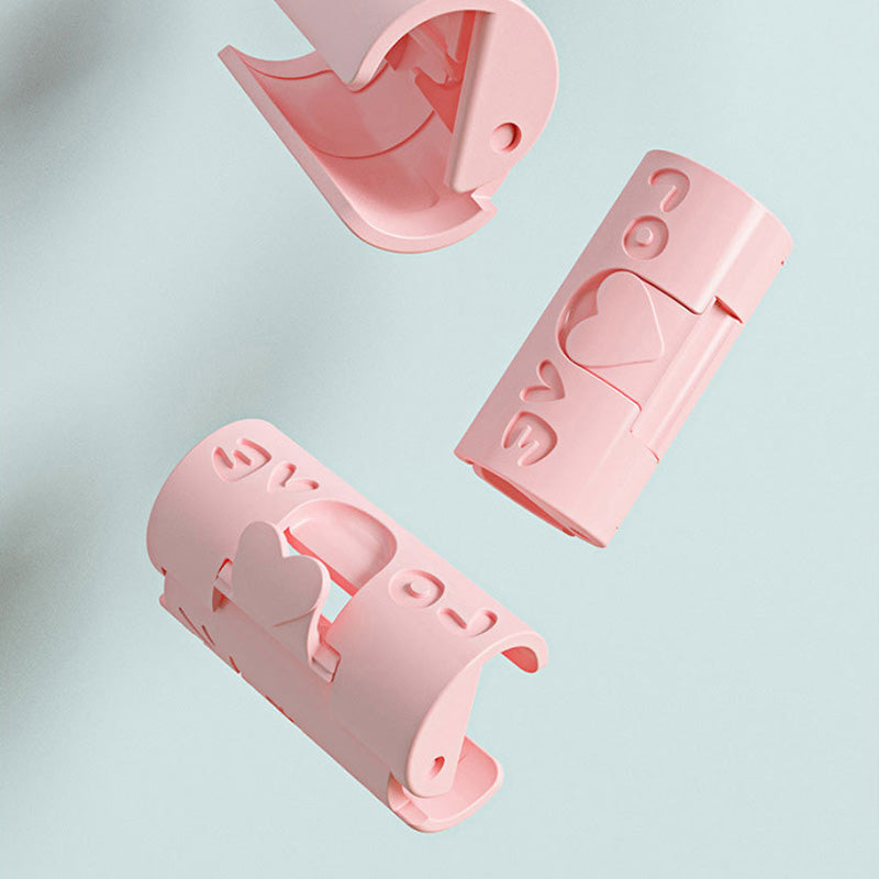 "Sänglakanhållare utan nålar i blå och rosa, funktionell och stilren, av slitstarkt ABS-material för prydligt sovrum."