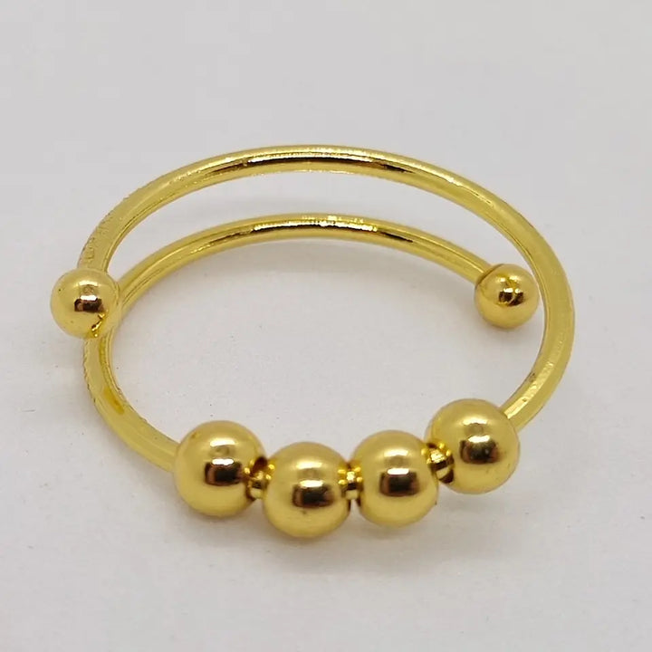 Kvinnors Serena avstressande ring, guldpläterad justerbar spinnerring mot ångest. Stilfullt anti-stress smycke.