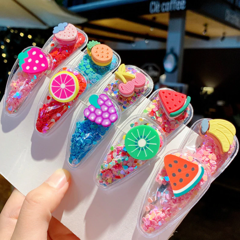 "Set med damhårklämmor i genomskinlig design, fyllda med färgglada paljetter, perfekt för alla hårtyper, 10-pack."