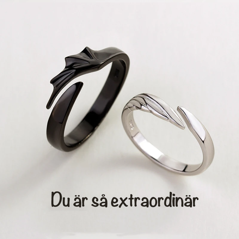Silver Angel And Demon Par Ringen för män och kvinnor, elegant kontrast av svart och vitt, symboliserar tidlös kärlek.
