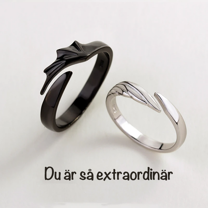 Silver Angel And Demon Par Ringen för män och kvinnor, elegant kontrast av svart och vitt, symboliserar tidlös kärlek.