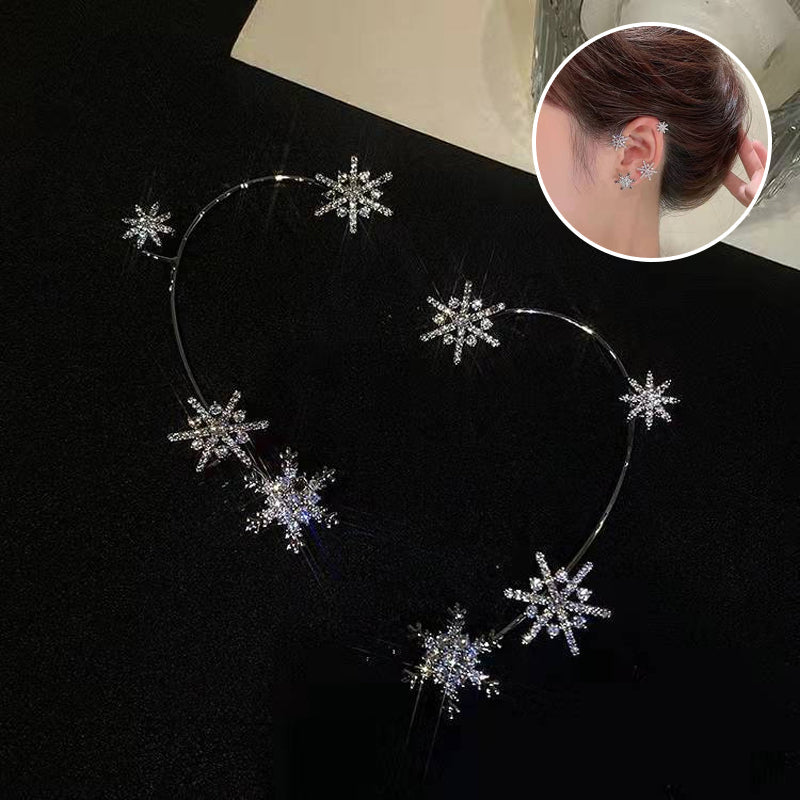 "Silver snöflinga örhängen utan piercing för damer, glänsande och stilren design, perfekt för alla tillfällen."