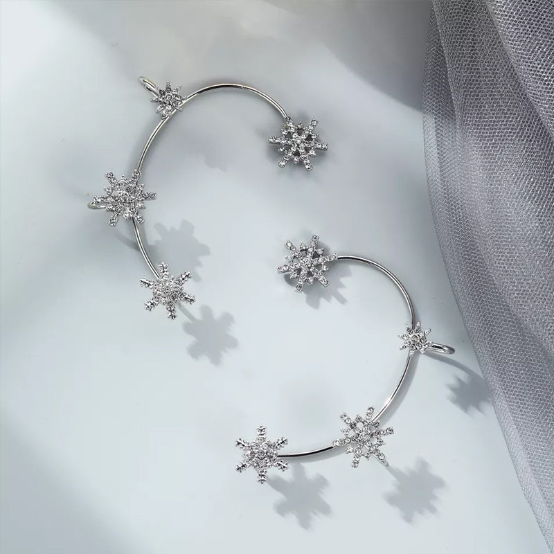 "Silver snöflinga örhängen utan piercing för damer, glänsande och stilren design, perfekt för alla tillfällen."